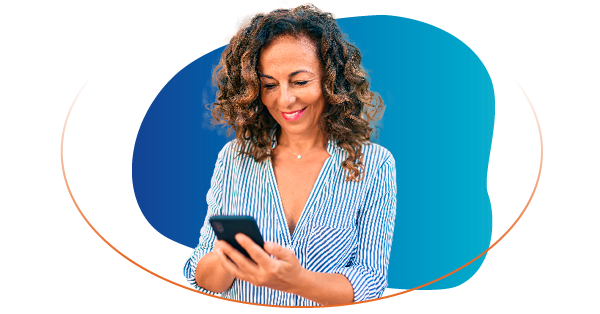 Smiling woman holding a mobile phone while looking at it